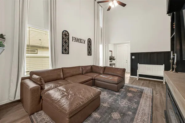 a living room with furniture and a rug