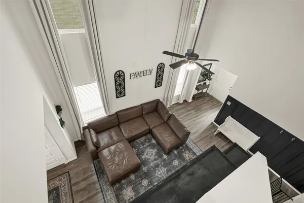 a view of living room with furniture and a rug