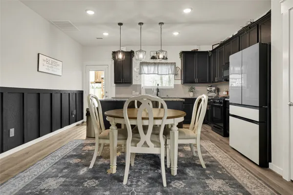 a view of a dining room with furniture