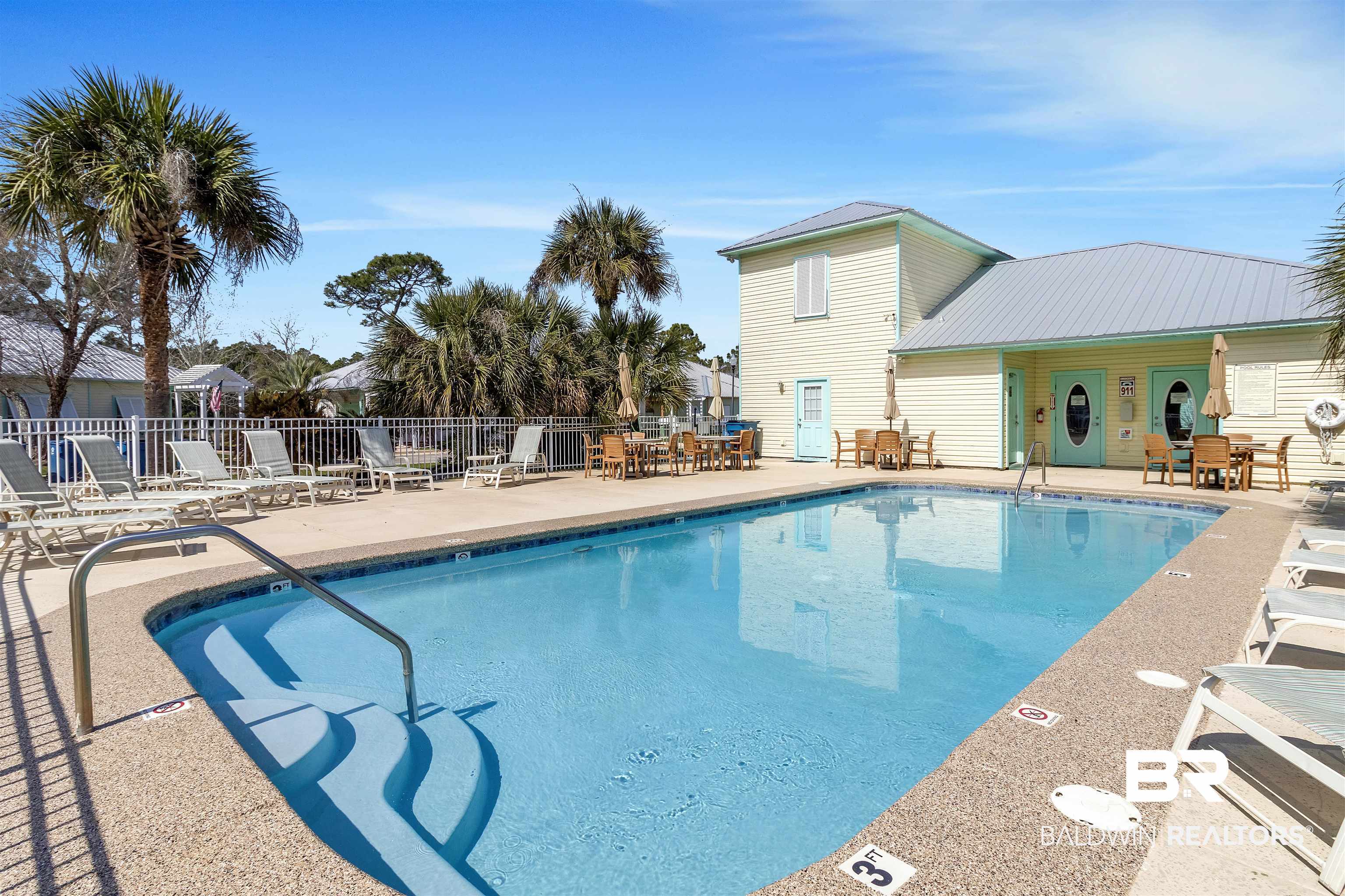 4324 B Lindsey Lane, Unit 4324B Orange Beach, AL 36561 - Photo 21 of 33 Pool with a patio area and fence