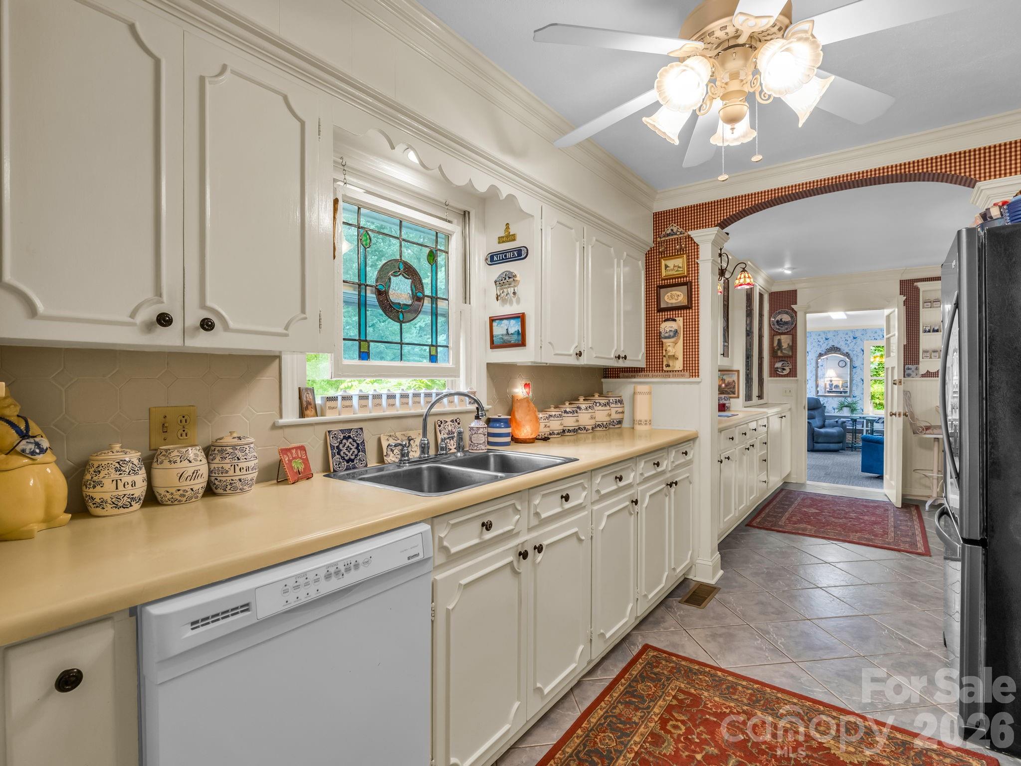 57 Tate Lane Tryon, NC 28782 - Photo 12 of 48 a kitchen with sink cabinets and window