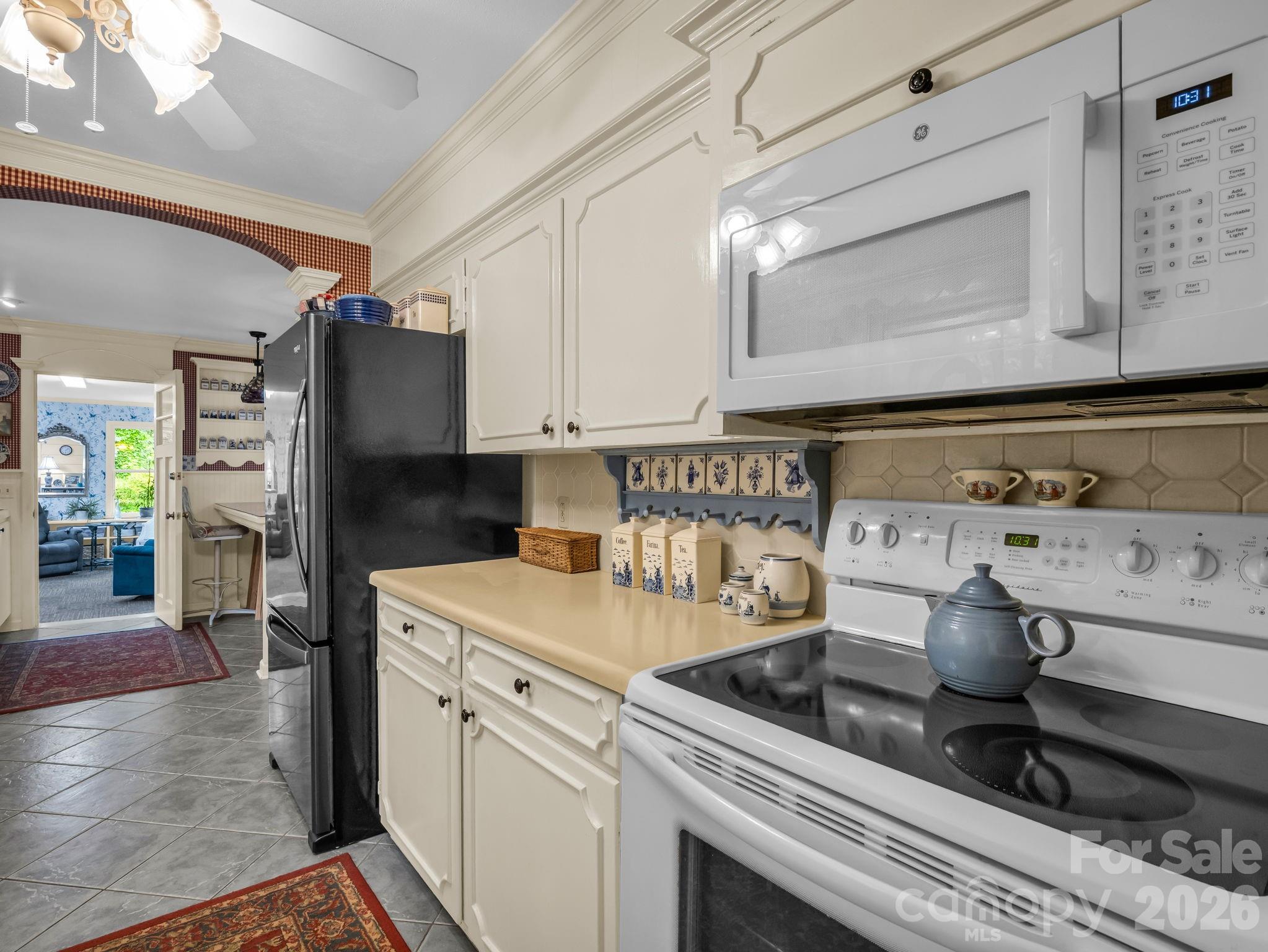57 Tate Lane Tryon, NC 28782 - Photo 13 of 48 a kitchen with a stove and a refrigerator