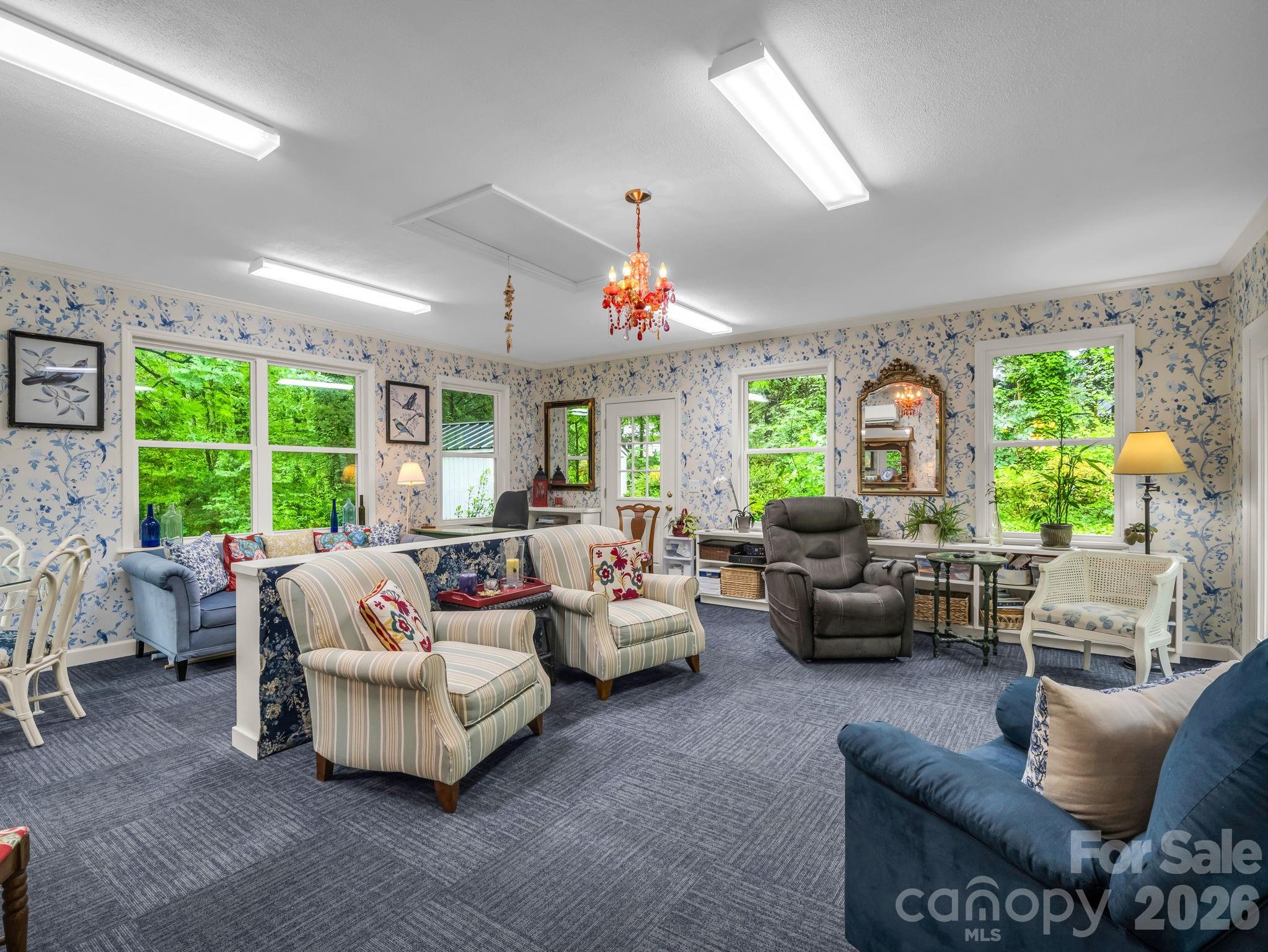 57 Tate Lane Tryon, NC 28782 - Photo 16 of 48 a living room with patio furniture and a large window