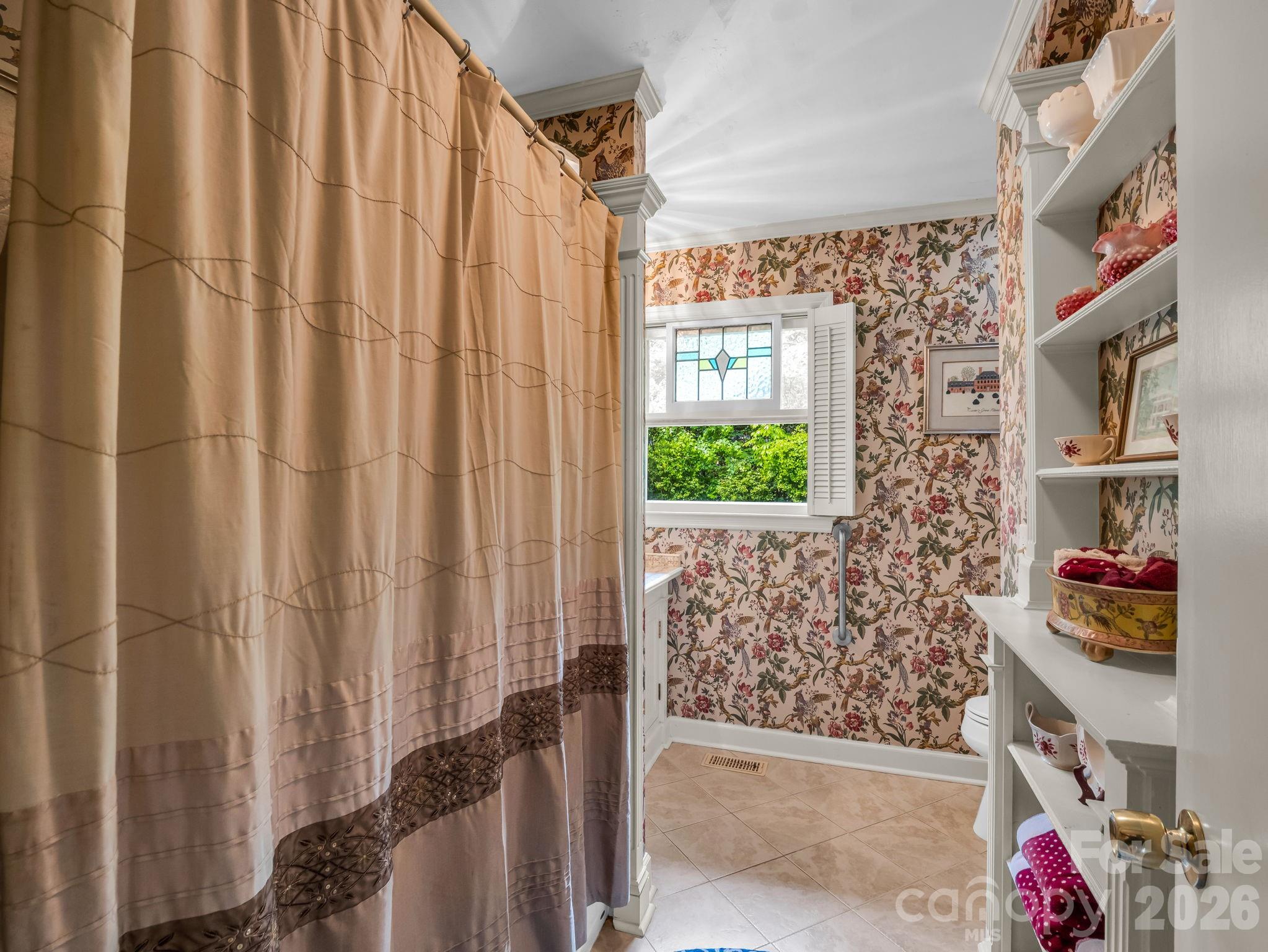 57 Tate Lane Tryon, NC 28782 - Photo 25 of 48 a view of a bathroom with a window and a shower