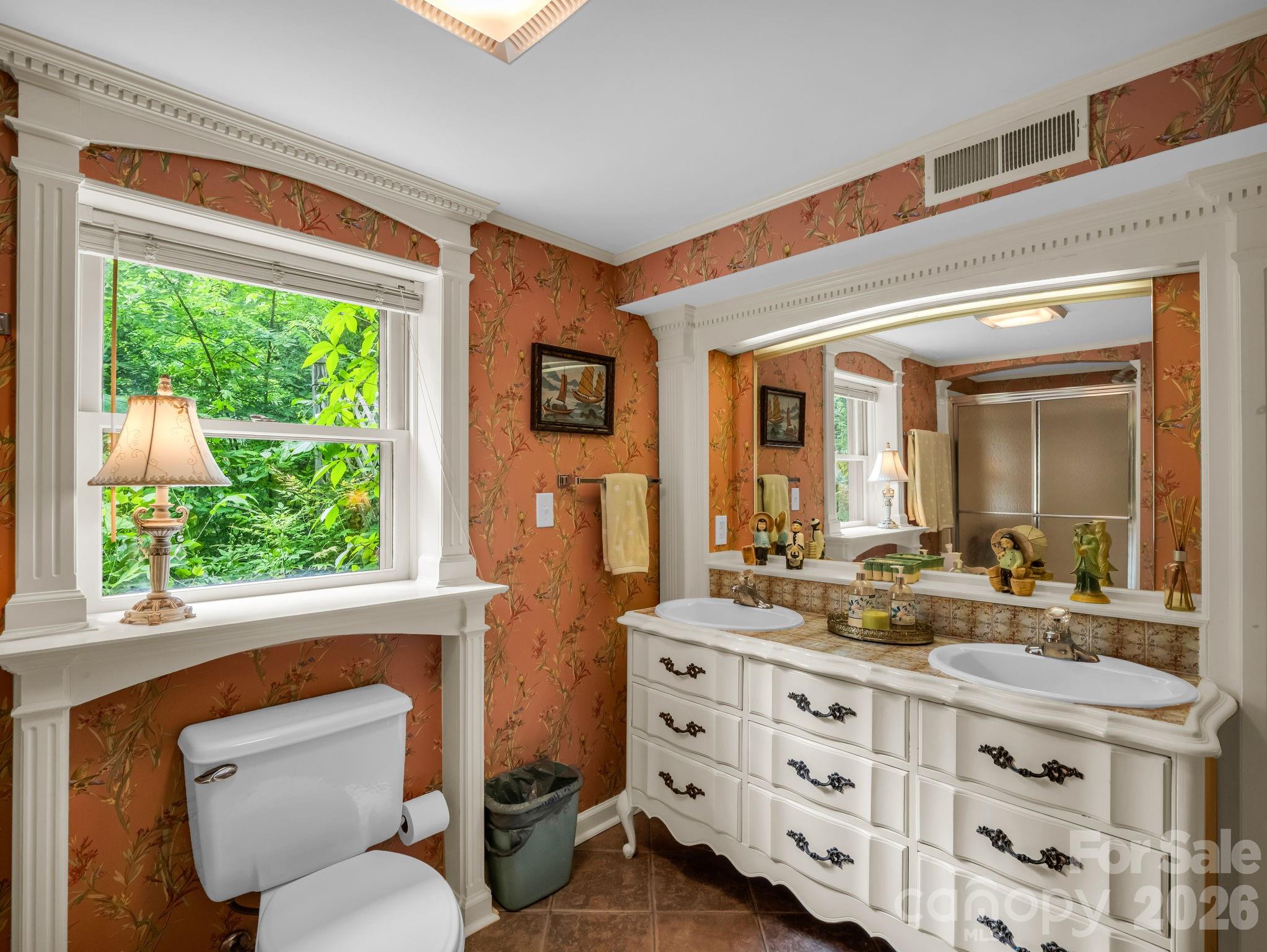 57 Tate Lane Tryon, NC 28782 - Photo 28 of 48 a bathroom with a granite countertop toilet sink and mirror