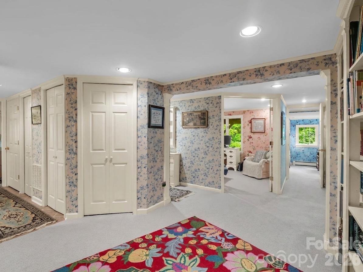 57 Tate Lane Tryon, NC 28782 - Photo 31 of 48 a spacious bedroom with a bed and a shower
