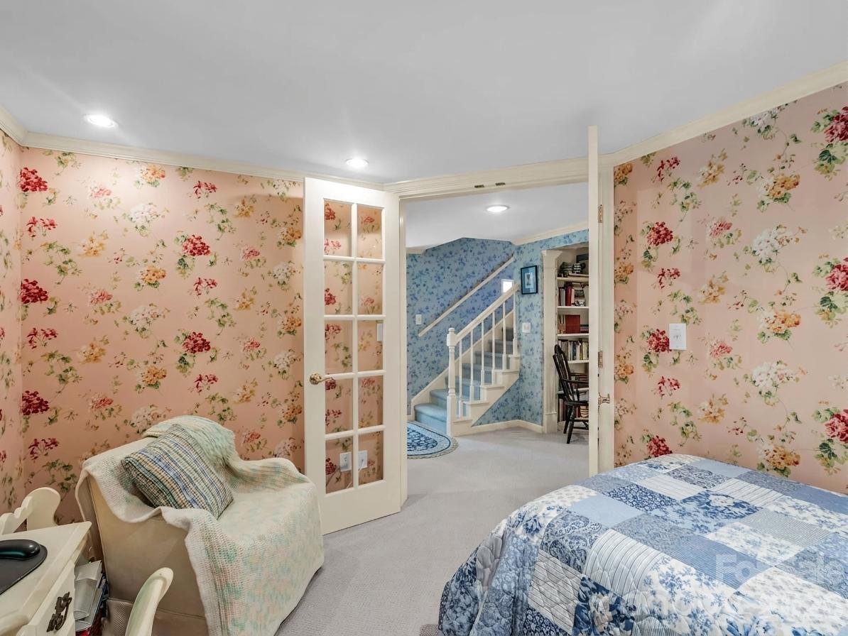 57 Tate Lane Tryon, NC 28782 - Photo 32 of 48 a spacious bedroom with a bed and a couch