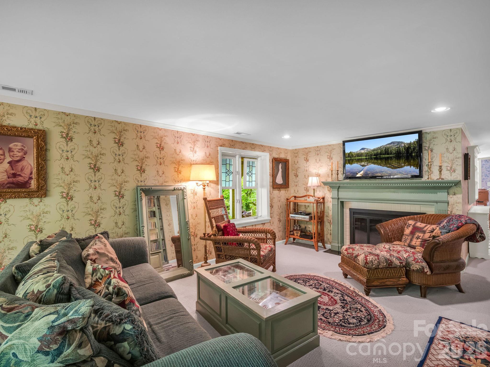 57 Tate Lane Tryon, NC 28782 - Photo 35 of 48 a living room with furniture and a fireplace