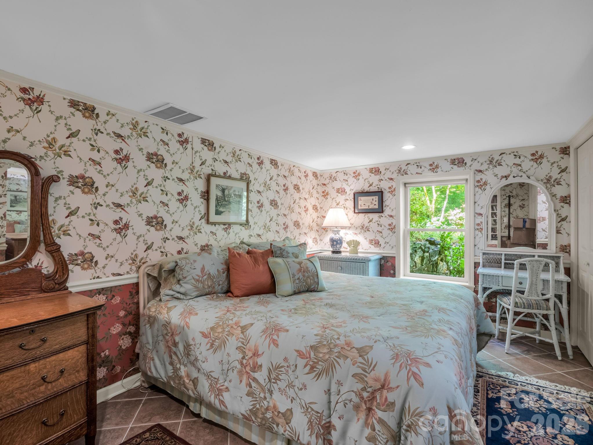 57 Tate Lane Tryon, NC 28782 - Photo 36 of 48 a bedroom with a bed and wooden floor