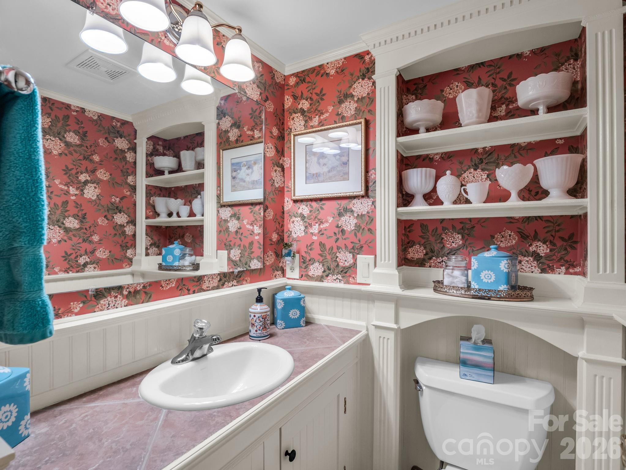 57 Tate Lane Tryon, NC 28782 - Photo 38 of 48 a bathroom with a sink a vanity and a large mirror