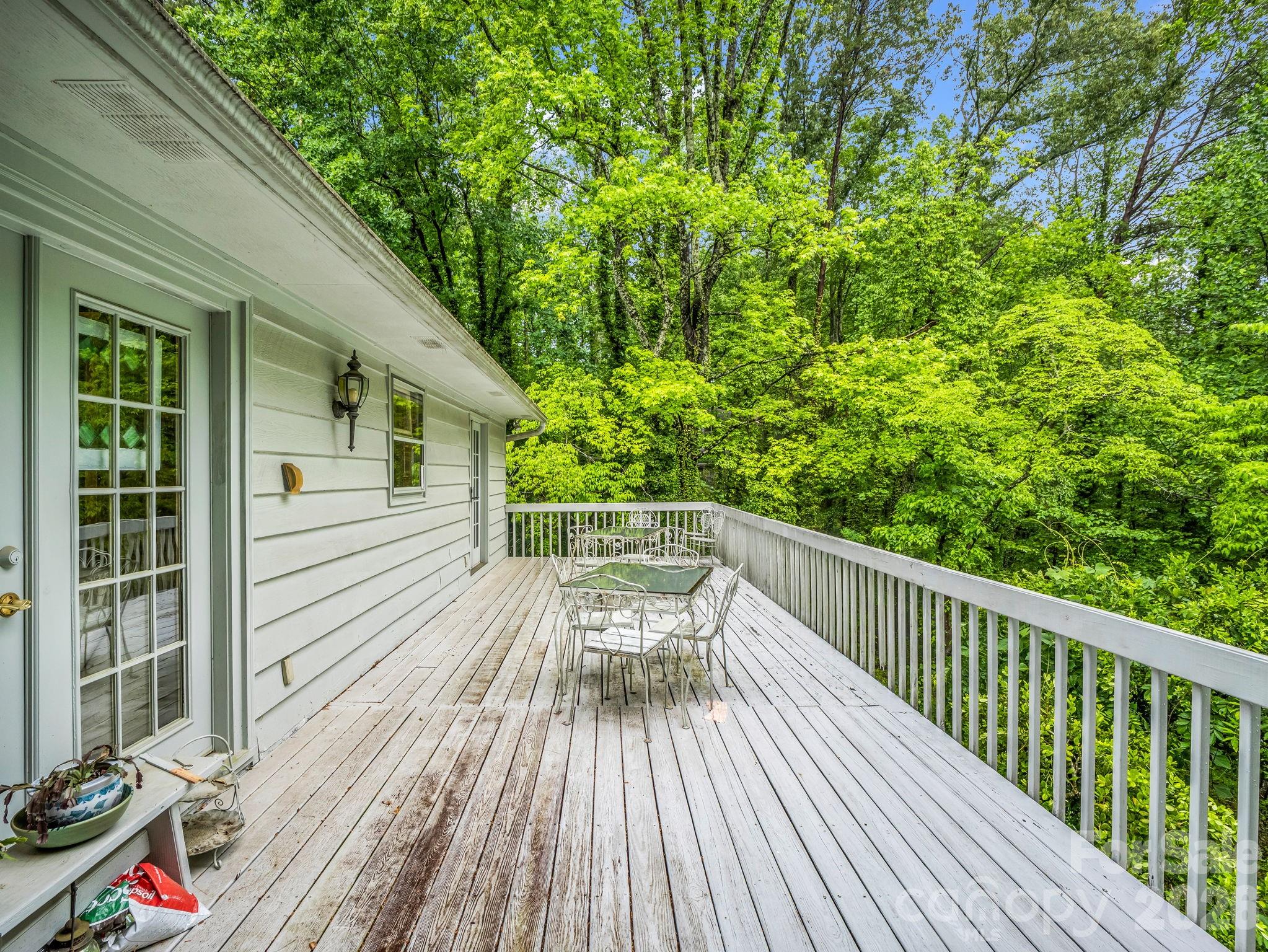 57 Tate Lane Tryon, NC 28782 - Photo 42 of 48 a view of balcony with deck and wooden floor