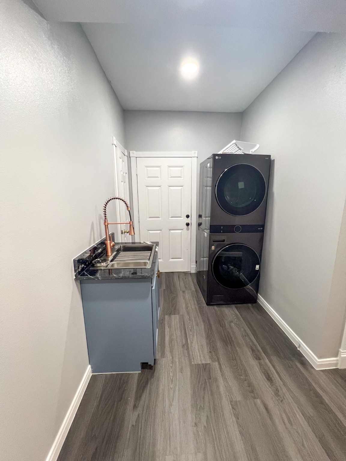 4605 Orange Street Houston, TX 77020 - Photo 14 of 28 a living room with a couch and a stove with wooden floor