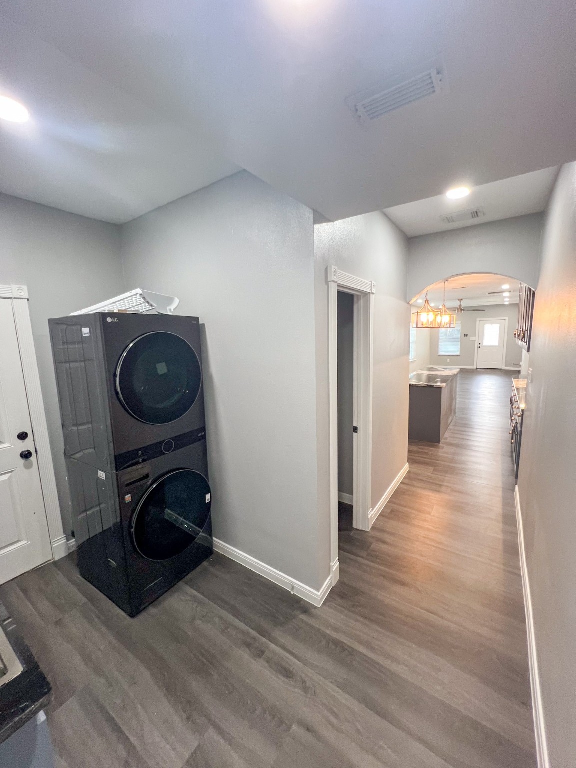 4605 Orange Street Houston, TX 77020 - Photo 15 of 28 a view of a hallway with wooden floor and a fireplace