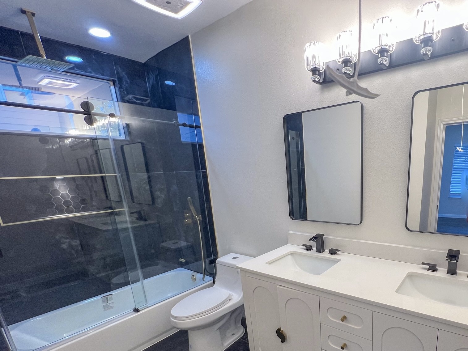 4605 Orange Street Houston, TX 77020 - Photo 22 of 28 a bathroom with a sink a toilet and shower