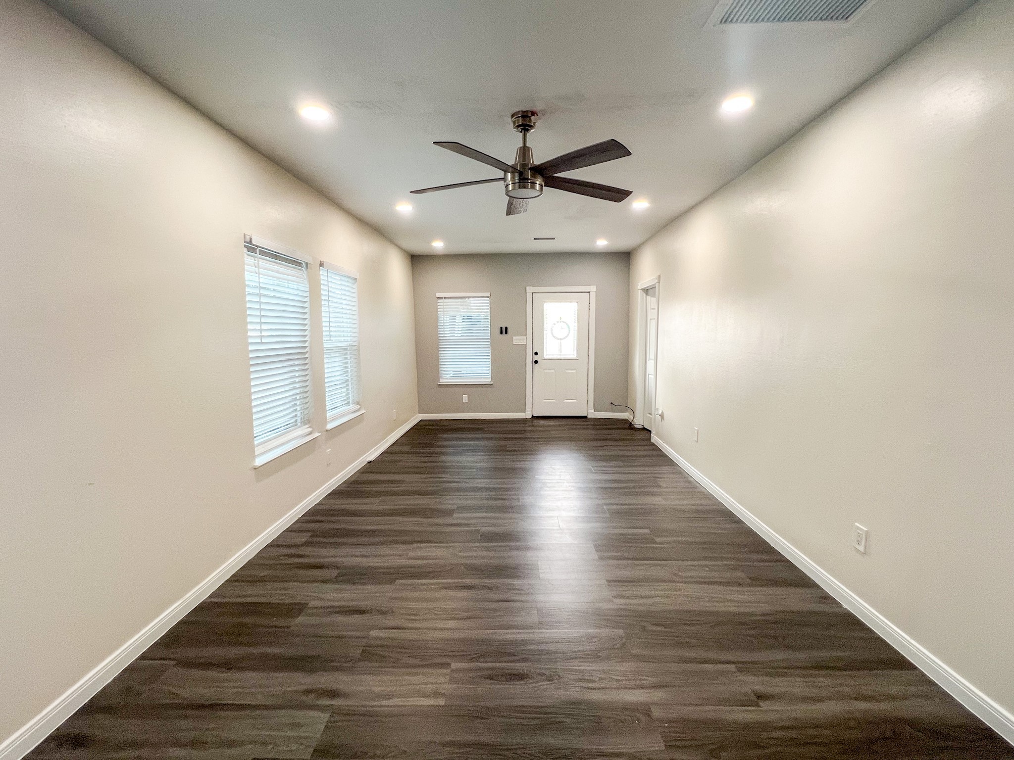 4605 Orange Street Houston, TX 77020 - Photo 27 of 28 an empty room with wooden floor and windows