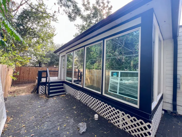 a view of outdoor space with deck and furniture