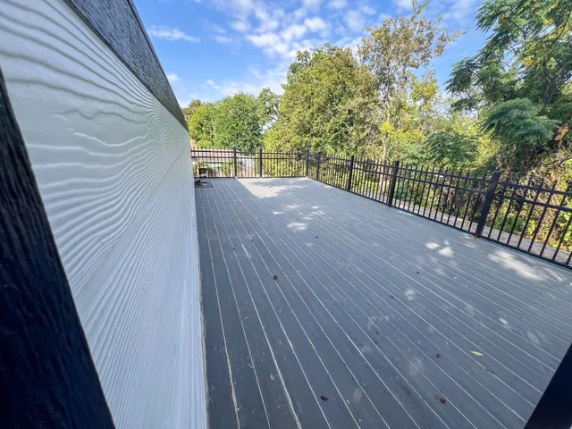 a view of balcony with wooden floor