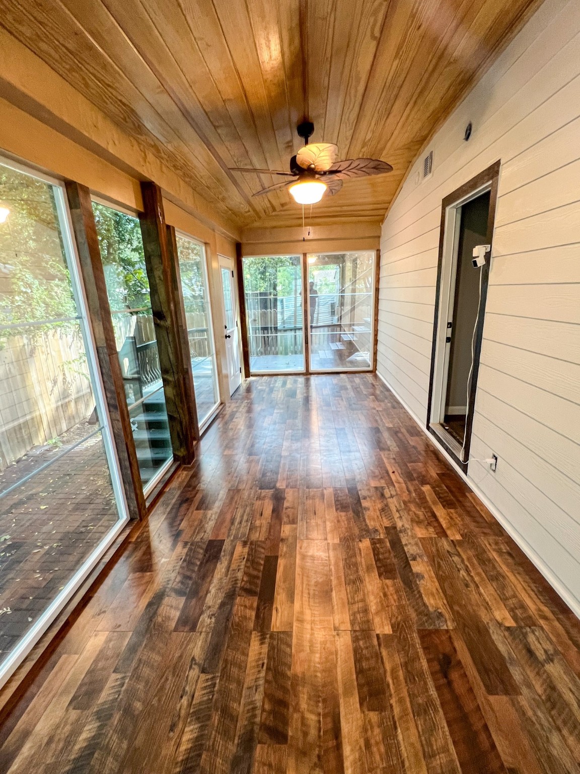 4605 Orange Street Houston, TX 77020 - Photo 8 of 28 a view of empty room with wooden floor and fan