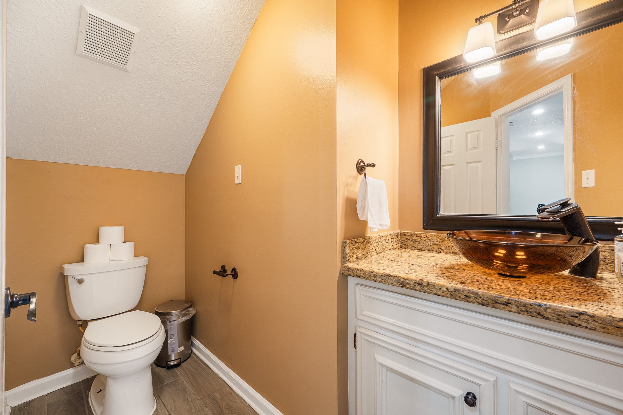 8111 Morningbrook Court Spring, TX 77379 - Photo 20 of 46 a bathroom with a granite countertop sink and a toilet