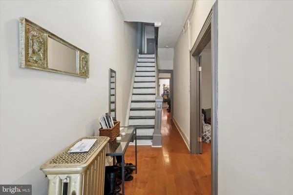 a view of entryway with wooden floor