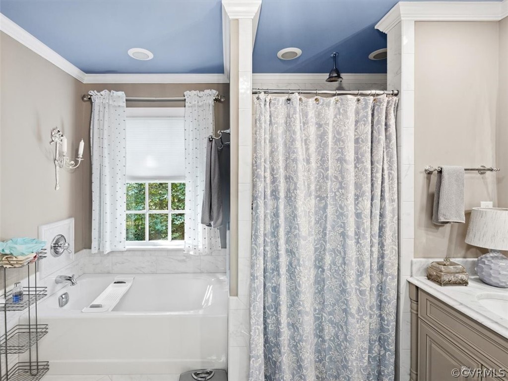 2310 Dorking Road North Chesterfield, VA 23236 - Photo 19 of 44 a bathroom with a tub a sink and a window