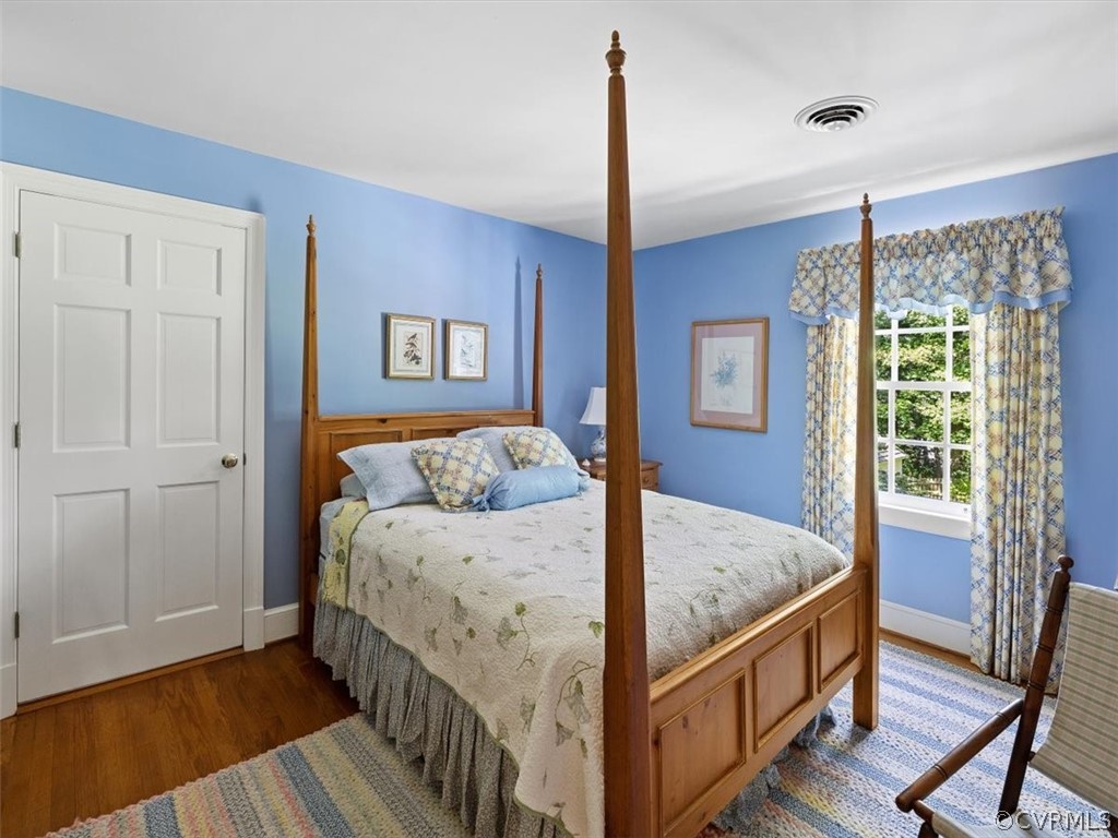2310 Dorking Road North Chesterfield, VA 23236 - Photo 32 of 44 a bedroom with a bed and wooden floor