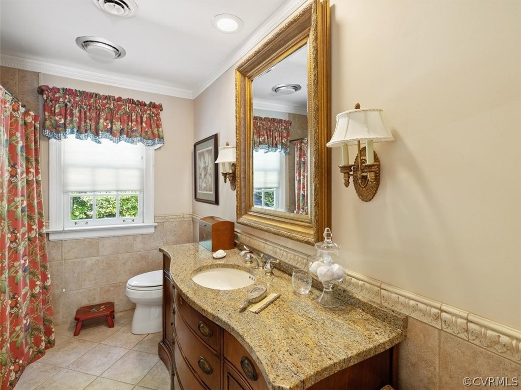 2310 Dorking Road North Chesterfield, VA 23236 - Photo 33 of 44 a bathroom with a granite countertop sink toilet and mirror