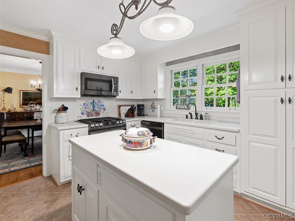 2310 Dorking Road North Chesterfield, VA 23236 - Photo 10 of 44 a kitchen with a stove a sink a microwave and cabinets