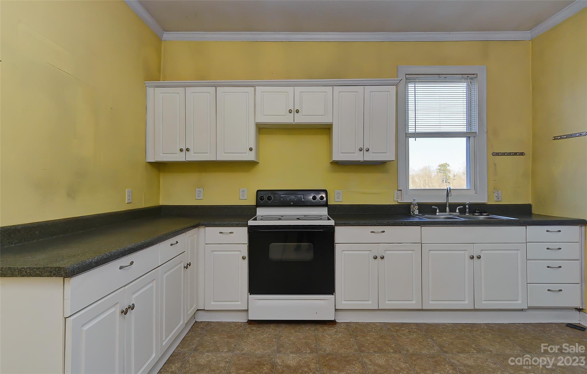 6202 White Store Pageland Road Marshville, NC 28103 - Photo 11 of 22 a kitchen with granite countertop a sink and a stove