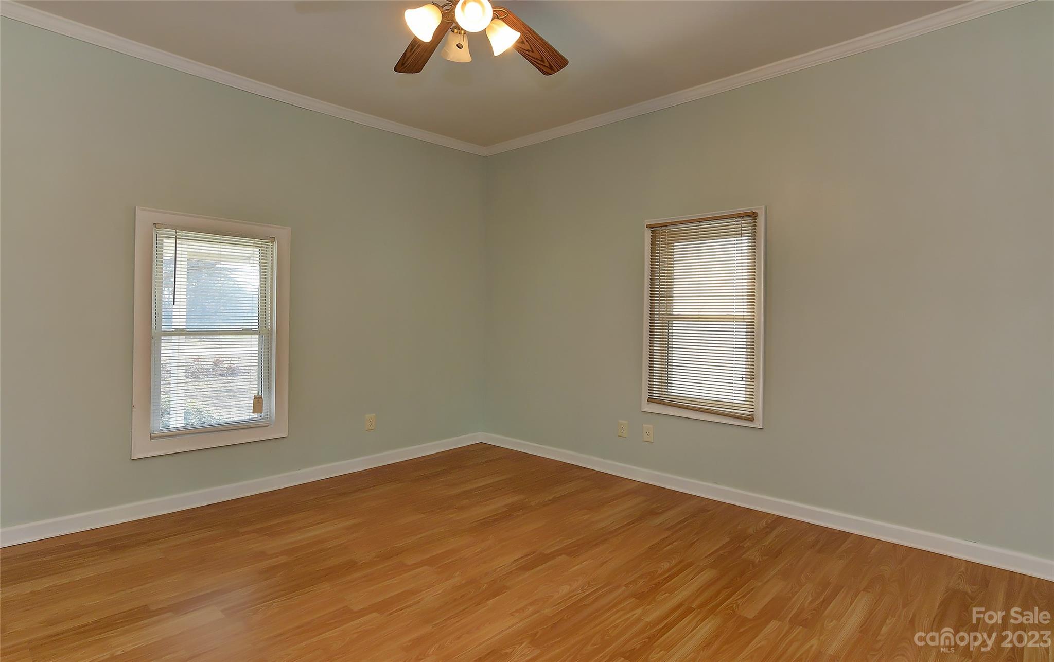 6202 White Store Pageland Road Marshville, NC 28103 - Photo 16 of 22 a view of an empty room with wooden floor and a window