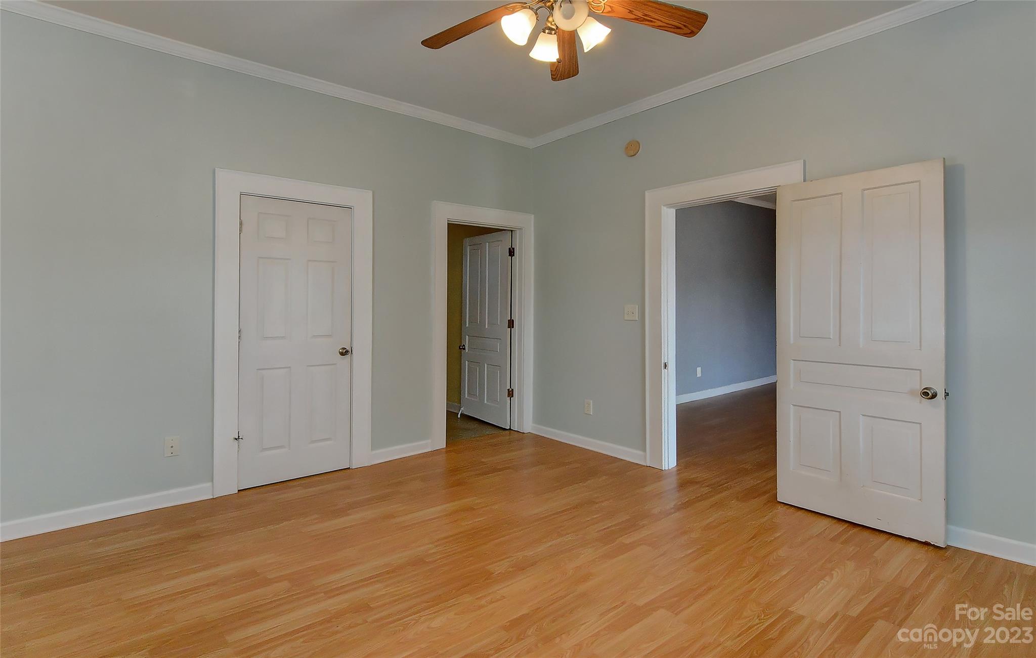 6202 White Store Pageland Road Marshville, NC 28103 - Photo 17 of 22 a view of an empty room with wooden floor closet and chandelier fan