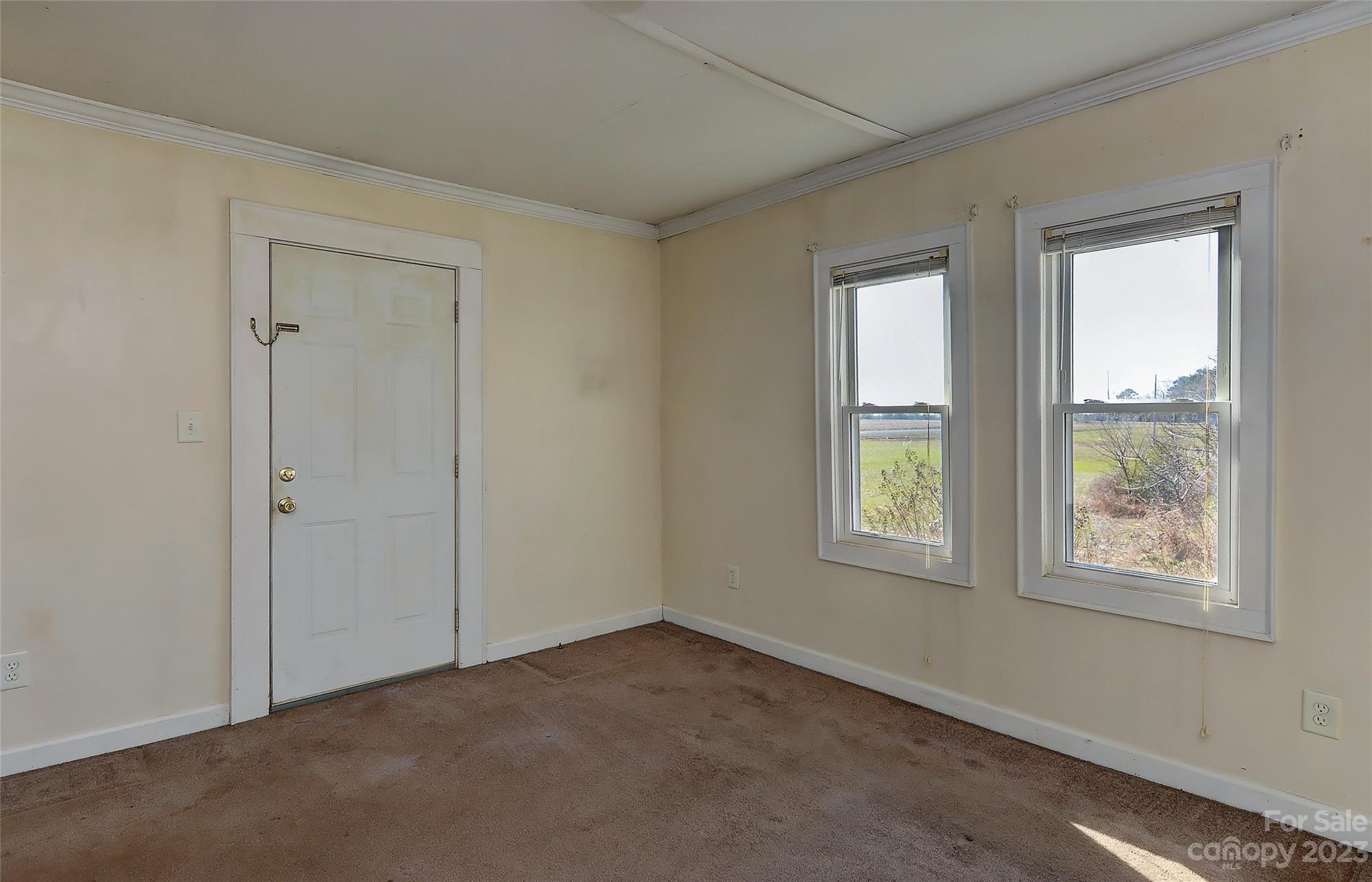 6202 White Store Pageland Road Marshville, NC 28103 - Photo 18 of 22 an empty room with windows