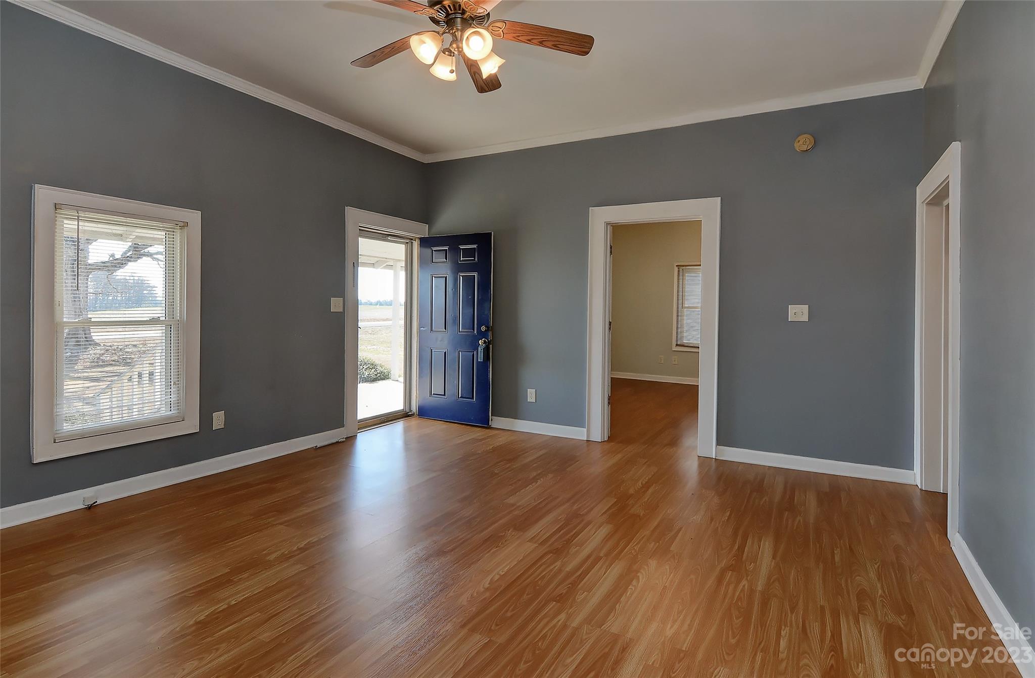 6202 White Store Pageland Road Marshville, NC 28103 - Photo 7 of 22 a view of an empty room with wooden floor and a window