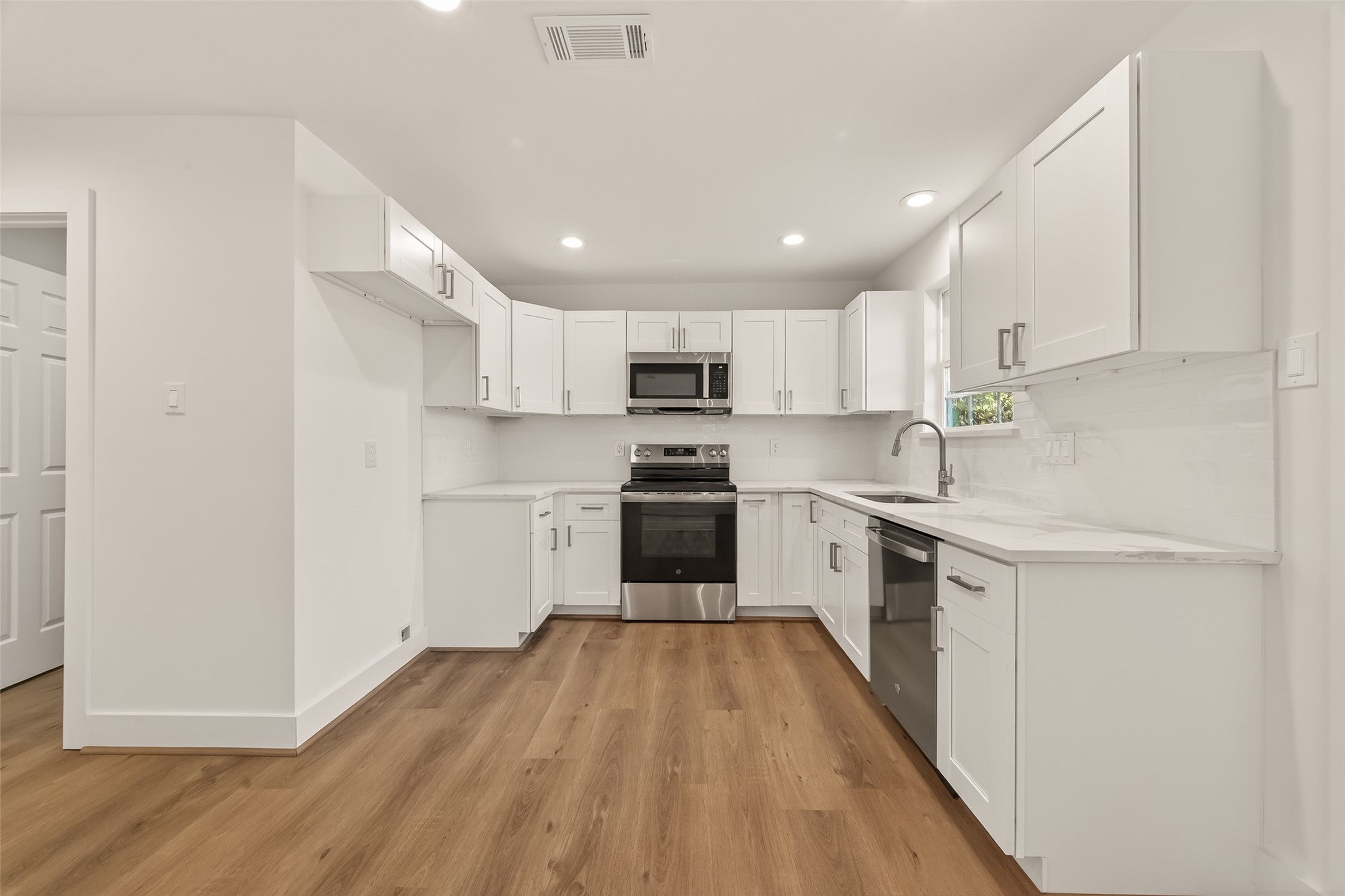 2723 Castledale Drive Houston, TX 77093 - Photo 12 of 38 a kitchen with a white stove top oven and refrigerator