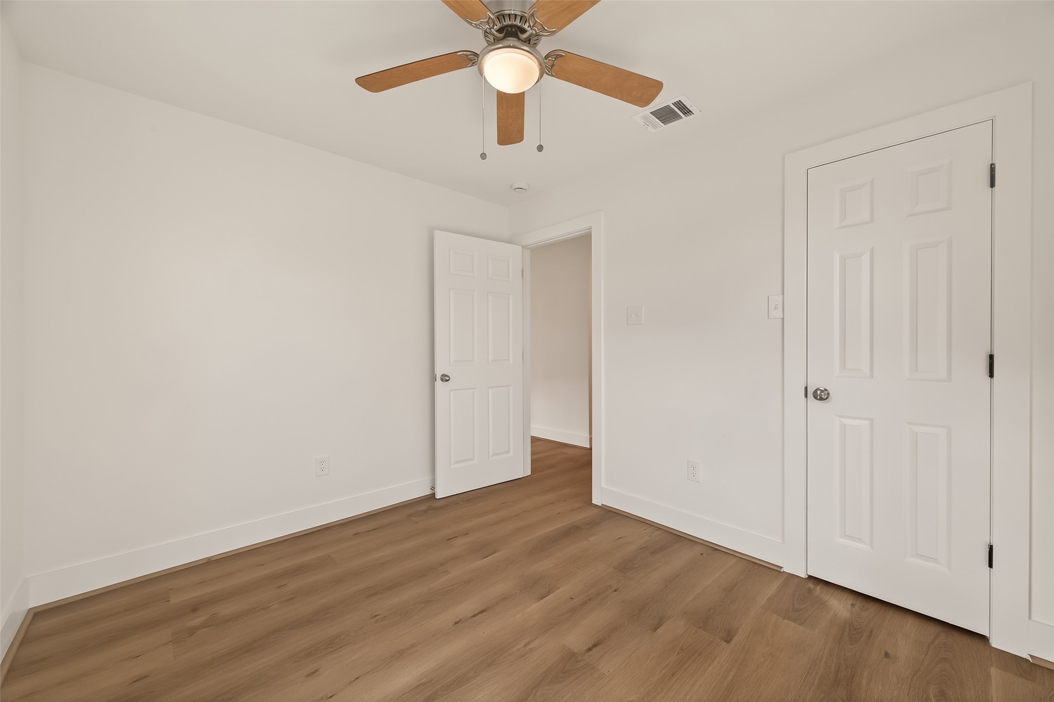 2723 Castledale Drive Houston, TX 77093 - Photo 27 of 38 a view of an empty room with a ceiling fan