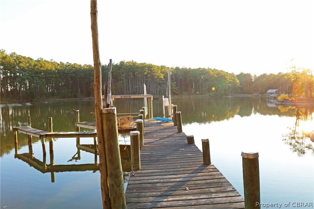 97 Barnes View Lane Kilmarnock, VA 22482 - Photo 2 of 20 Dock with extra slip, boat lift and jet ski lift in protected cove so as not to block your fabulous views of the bay.