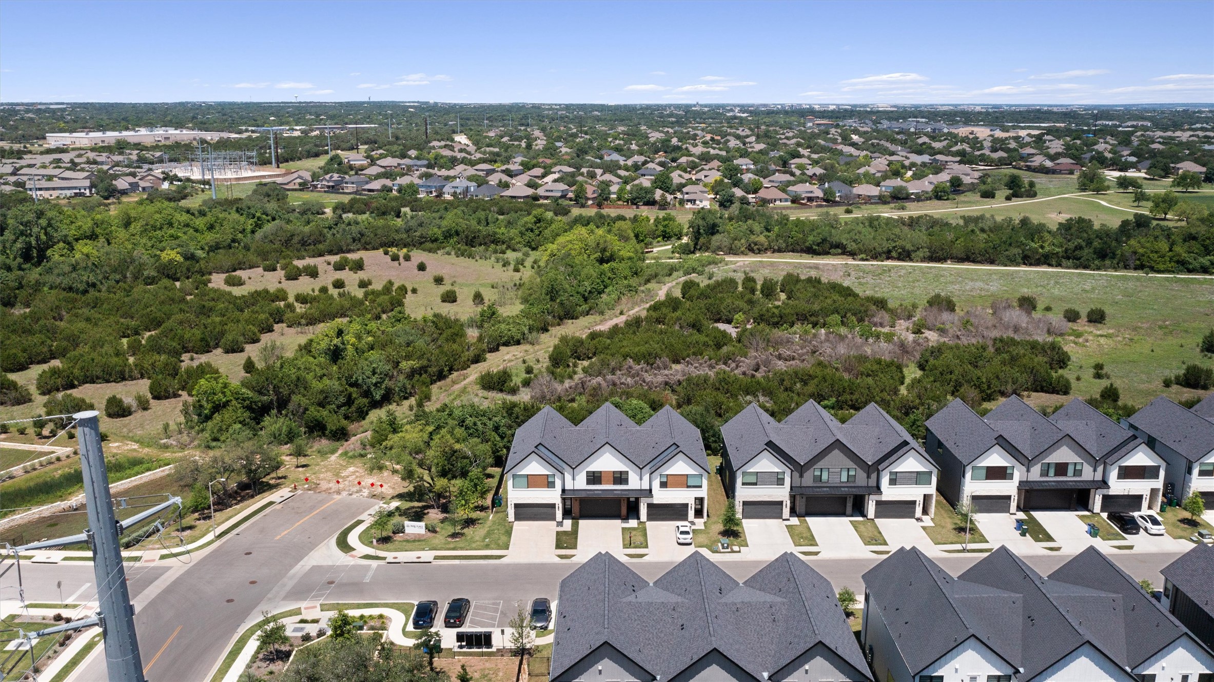 590 Old Mill Road, Unit 153 Cedar Park, TX 78613 - Photo 34 of 40 an aerial view of residential houses with outdoor space