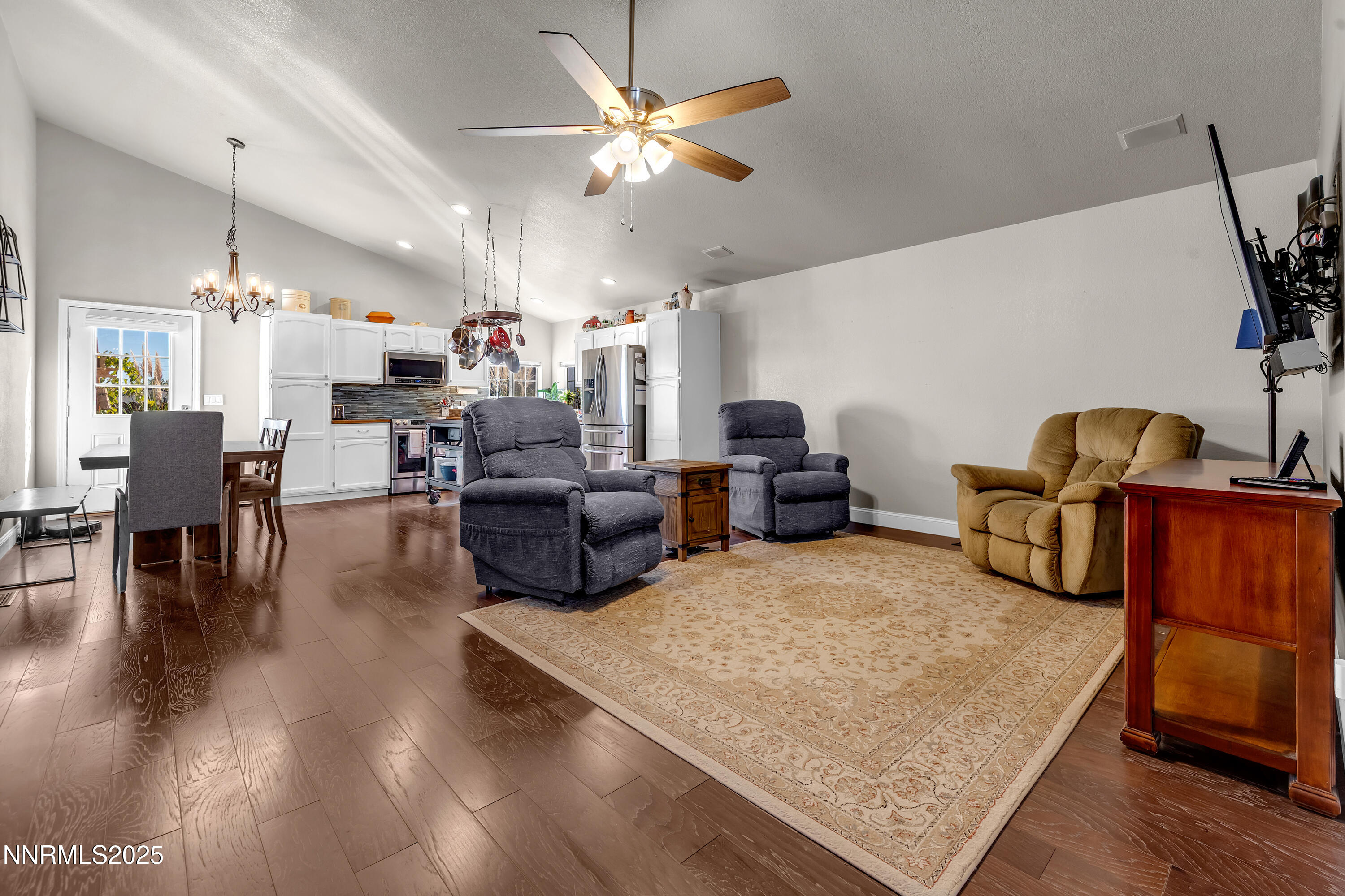 1077 Deena Way Fallon, NV 89406 - Photo 12 of 38 a living room with furniture and a chandelier