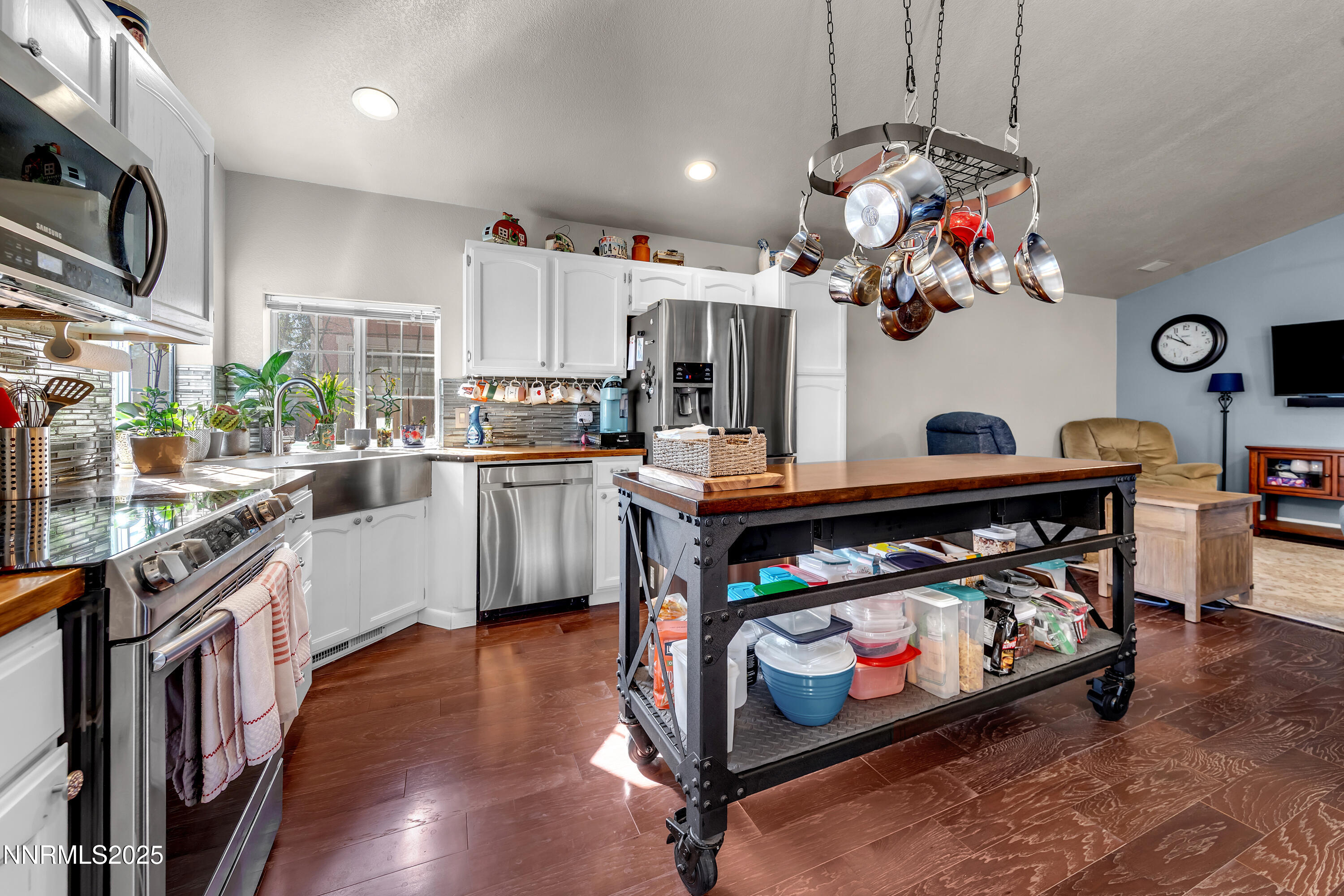 1077 Deena Way Fallon, NV 89406 - Photo 14 of 38 a kitchen with stainless steel appliances granite countertop a stove a sink and a refrigerator