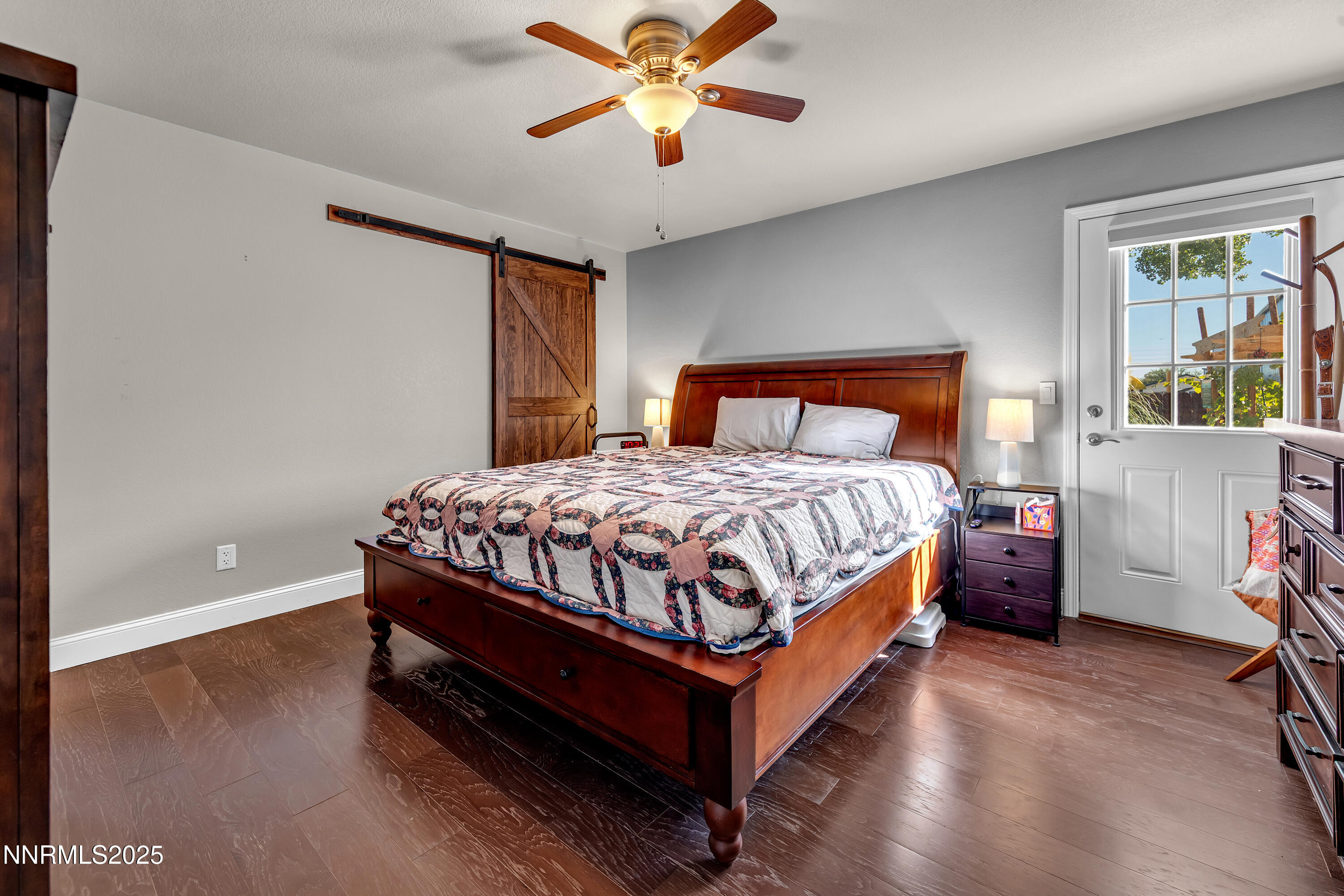 1077 Deena Way Fallon, NV 89406 - Photo 20 of 38 a bedroom with a bed and a chandelier