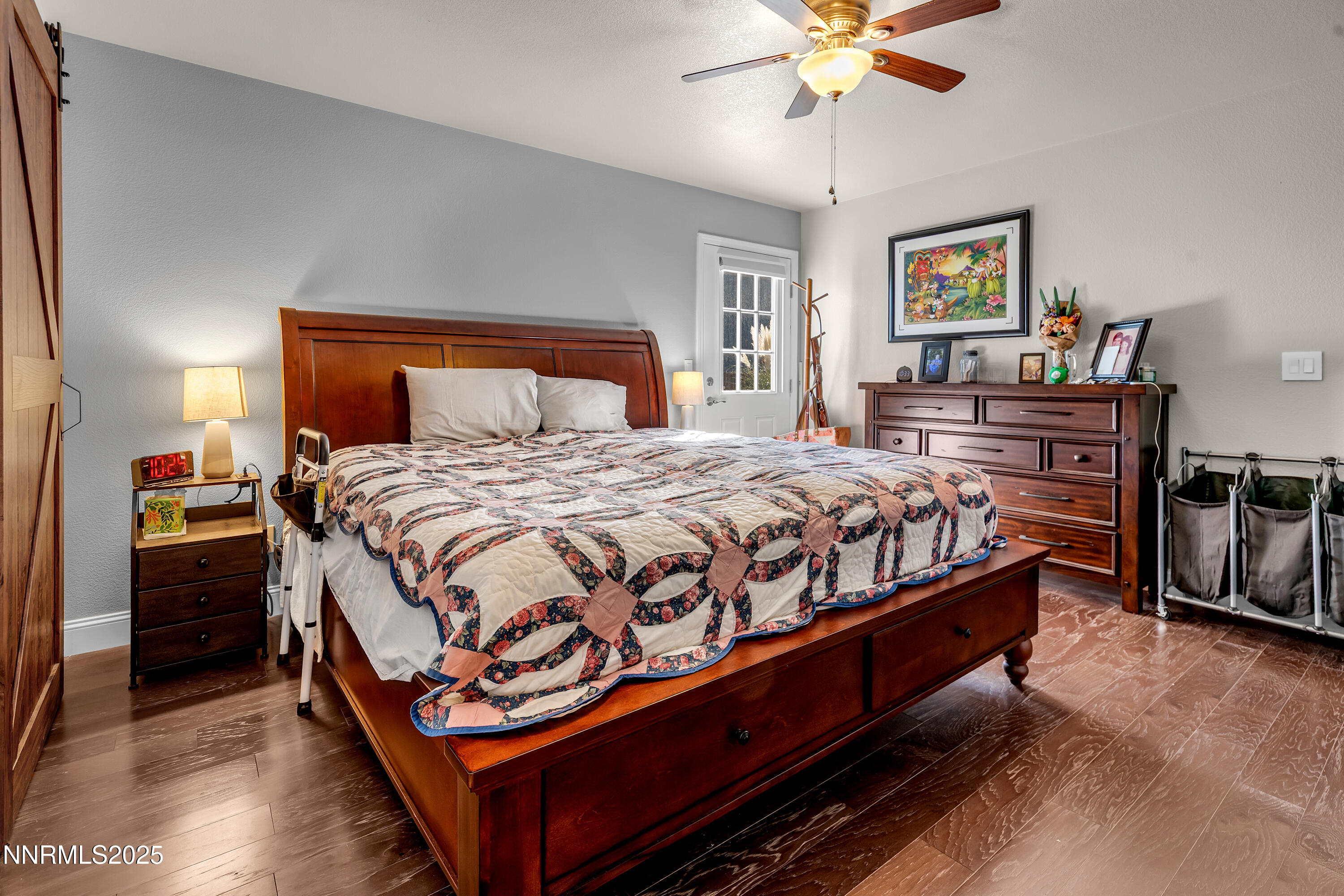 1077 Deena Way Fallon, NV 89406 - Photo 22 of 38 a bedroom with a bed and a chandelier