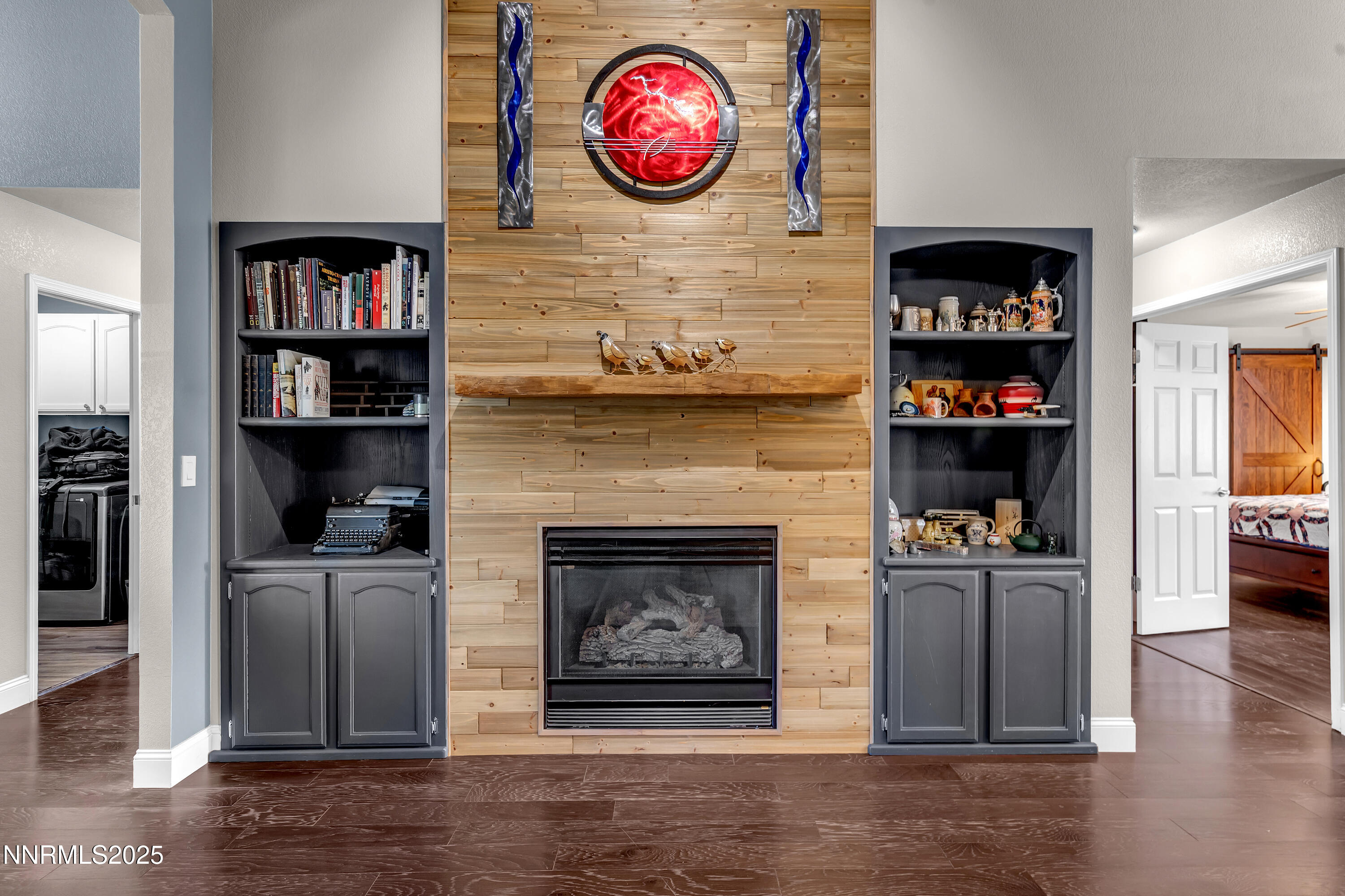 1077 Deena Way Fallon, NV 89406 - Photo 9 of 38 a living room with furniture wooden floor and a fireplace