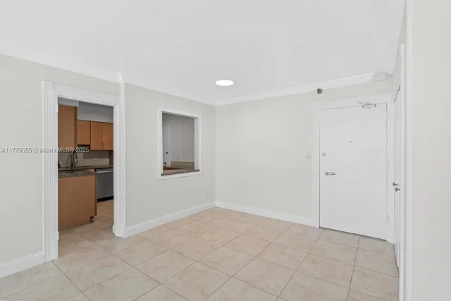 a kitchen with stainless steel appliances granite countertop a refrigerator stove and sink