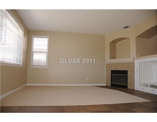 4717 Arial Ridge Street Las Vegas, NV 89147 - Photo 6 of 22 Den. family room with fireplace