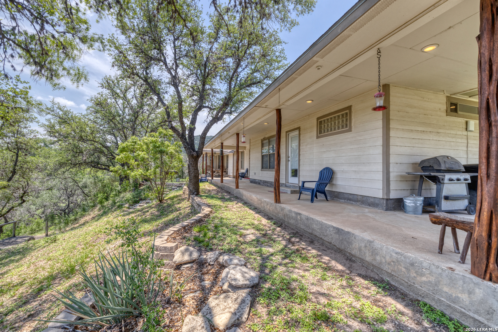 270 Robinson Road Concan, TX 78838 - Photo 13 of 50 a view of a backyard with sitting area