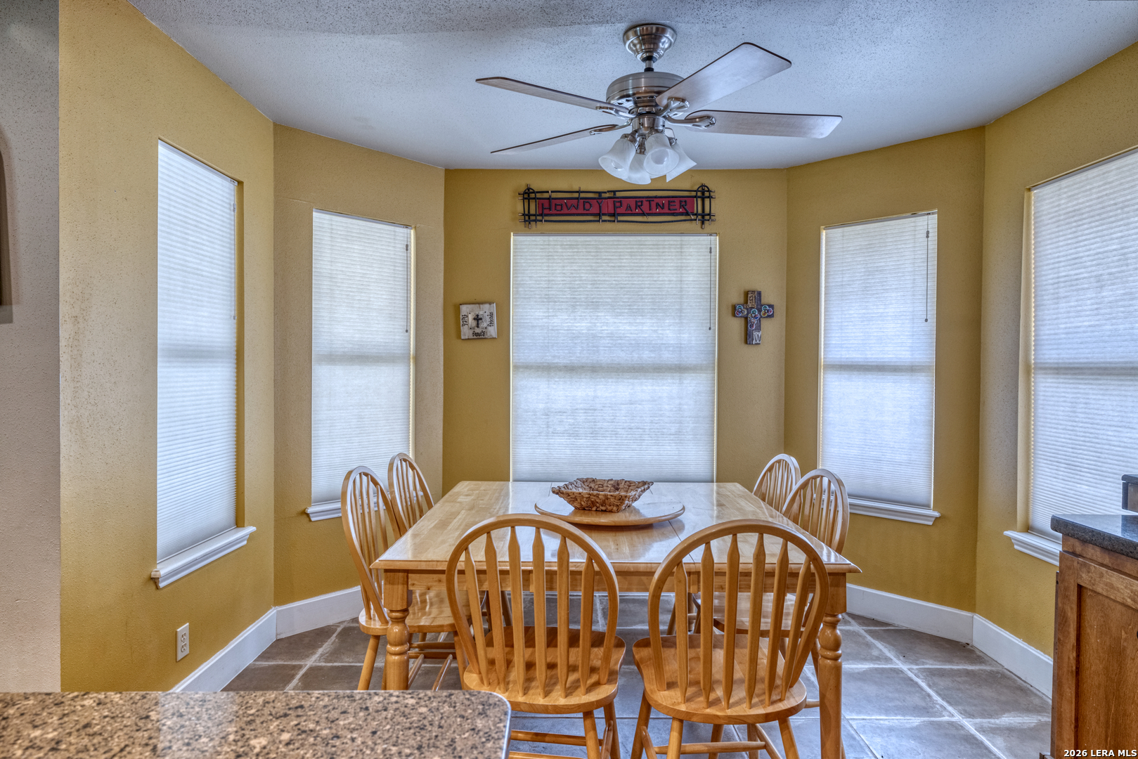 270 Robinson Road Concan, TX 78838 - Photo 23 of 50 a view of a dining room with furniture and a chandelier fan