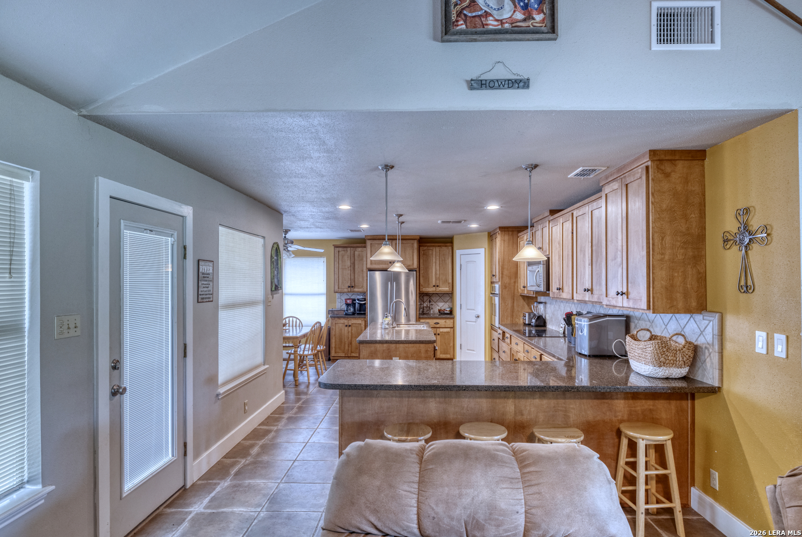 270 Robinson Road Concan, TX 78838 - Photo 30 of 50 a living room with furniture and a large window