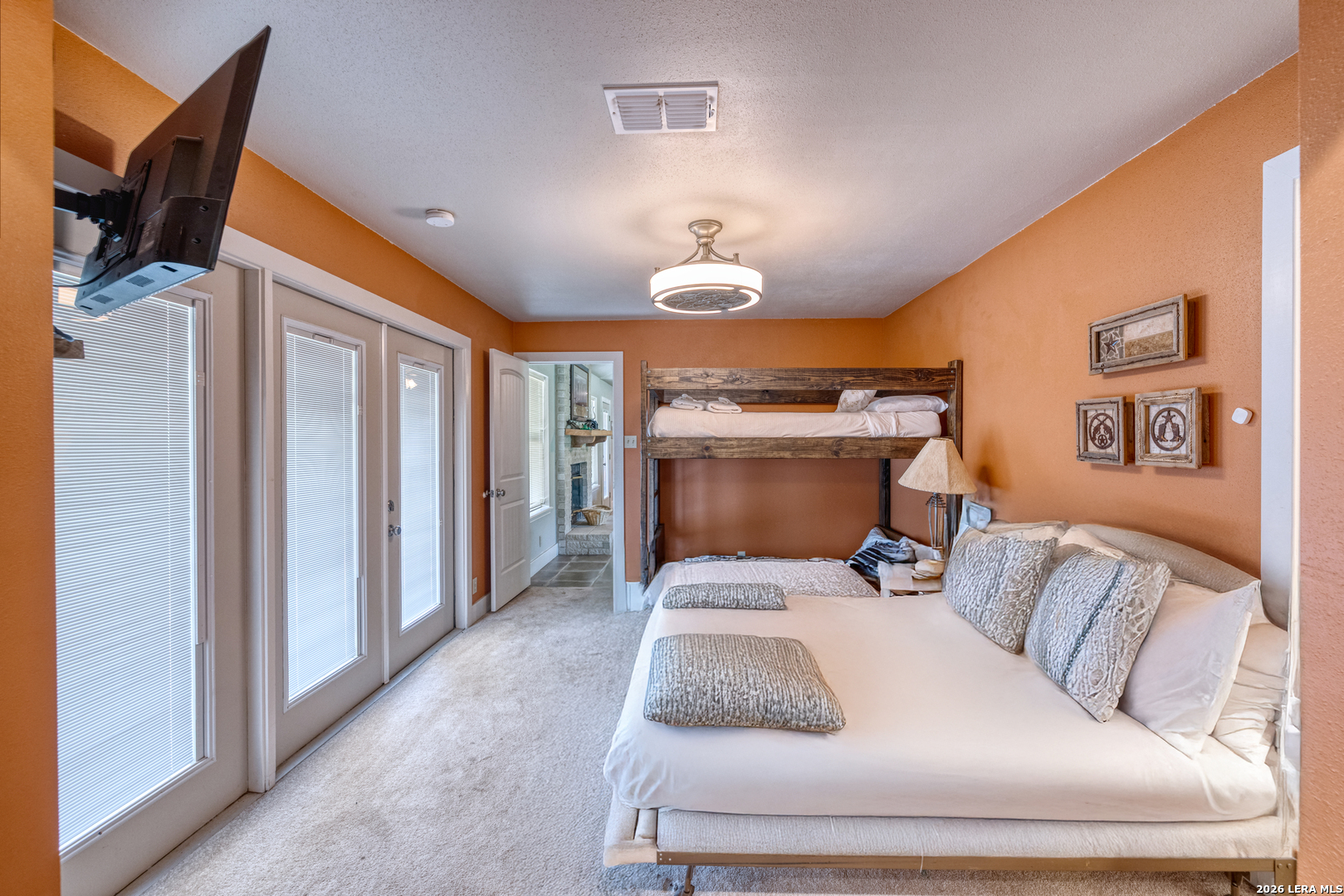 270 Robinson Road Concan, TX 78838 - Photo 32 of 50 a living room with furniture and a fireplace