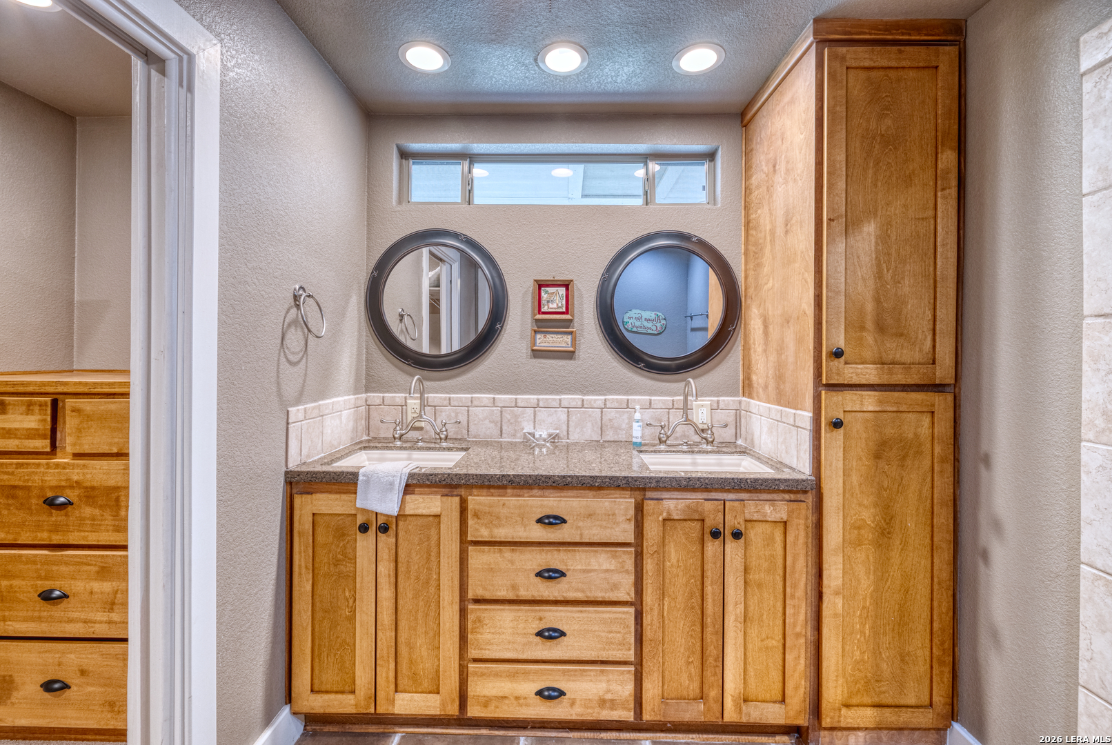 270 Robinson Road Concan, TX 78838 - Photo 35 of 50 a bathroom with a sink and a mirror