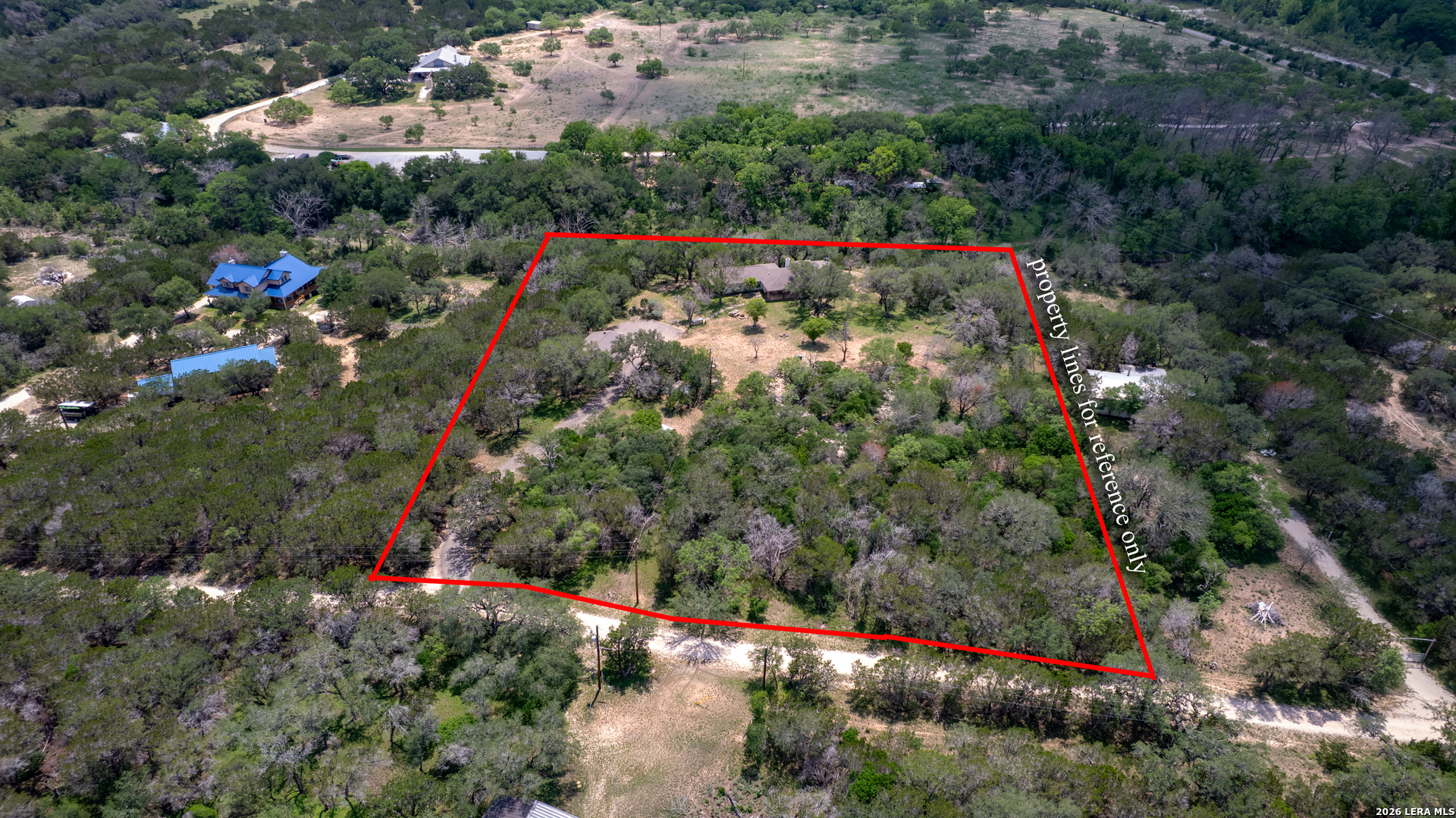 270 Robinson Road Concan, TX 78838 - Photo 38 of 50 an aerial view of house with yard